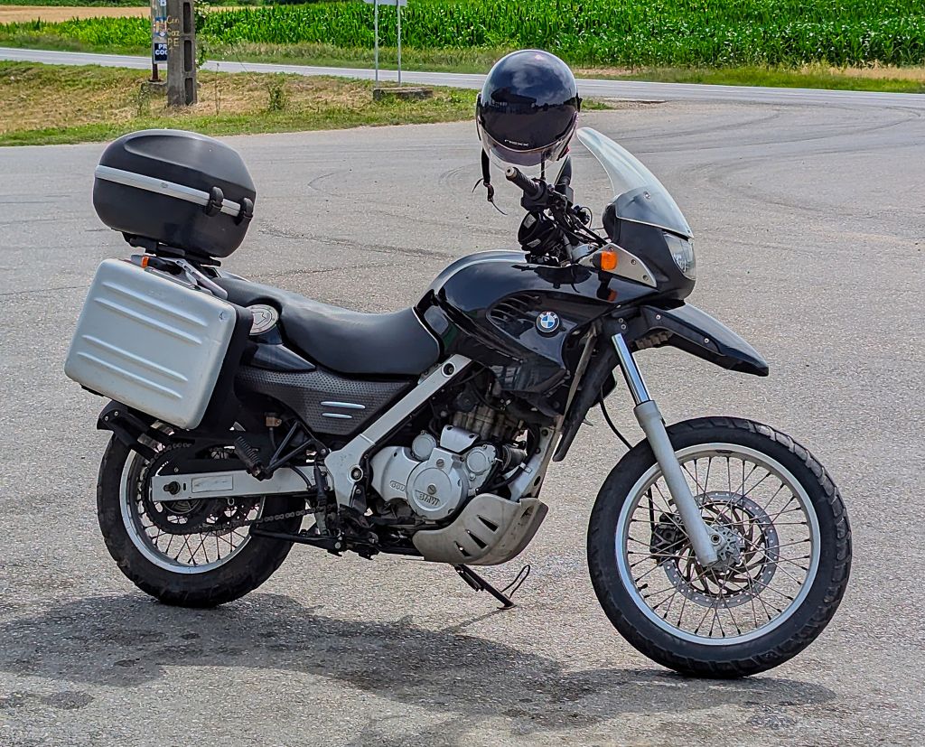 BMW F 650 GS 2007 motorcycle parked on a mountain road in Romania, perfect for touring with MOTOAVENTURA rentals BMW F 650 GS 2000 motorcycle on a scenic road in Romania, ready for adventure with MOTOAVENTURA motorcycle rentals BMW F 650 GS rental BMW motorcycle Romania Motorcycle rental Romania Scenic road Romania Adventure motorcycle rental Transfăgărășan motorcycle ride Motorcycle touring Romania BMW F 650 GS touring BMW F 650 GS 2000 BMW F 650 GS 2007 MOTOAVENTURA motorcycle rental Motorcycle exploration Romania Road-ready BMW motorcycle Off-road motorcycle Romania BMW F 650 GS mountain roads Brasov Transylvania Moto